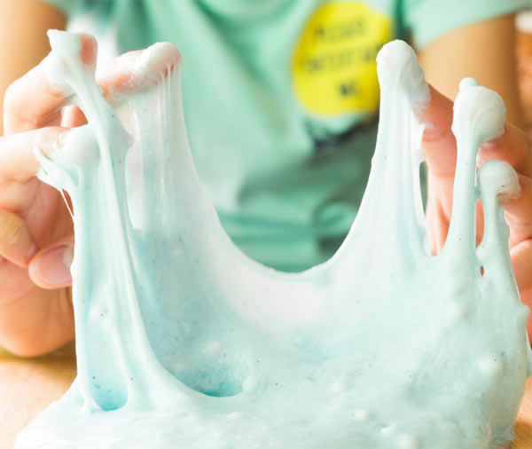 Hands playing with slime